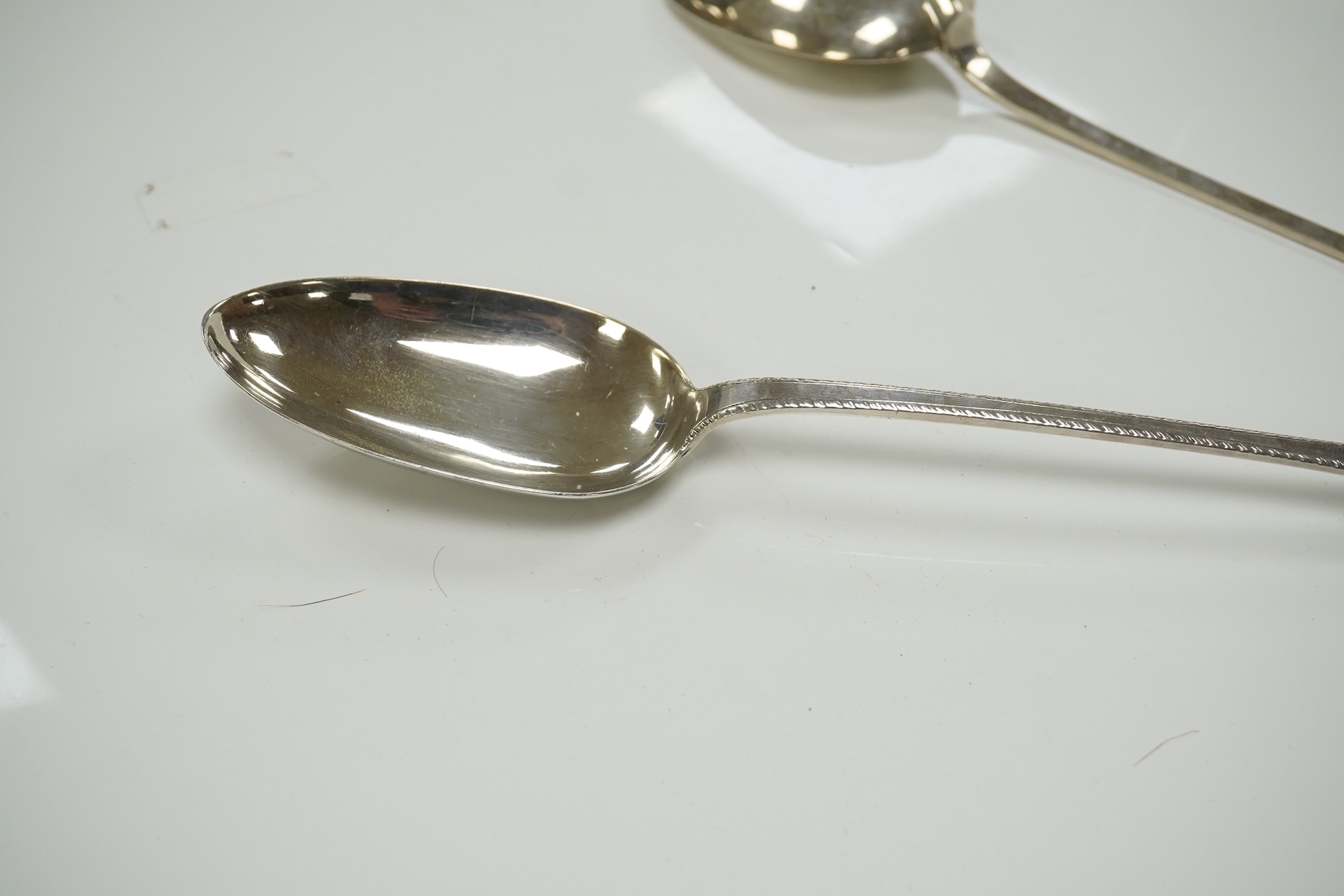 A pair of early Victorian Scottish silver Old English feather edge pattern basting spoons, Marshall & Sons, Edinburgh, 1840, 30cm, 5.8oz. Condition - fair